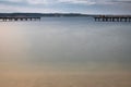 PortoroÃÂ¾, Slovenia - May 26, 2019 - people relaxing on wooden footbridge pier in PortoroÃÂ¾ on adriatic coastline Royalty Free Stock Photo