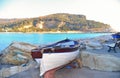 Portovenere, Italy  View on Palmaria island from Portovenere beach with old  wooden boat . Liguria Royalty Free Stock Photo