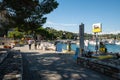 Portovenere, Liguria, Italy. June 2020. View of the seascape: on the waterfront a petrol station, moored boats, the green hills