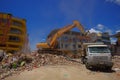 Portoviejo, Ecuador - April, 18, 2016: Heavy machinery picking rubble from destroyed buildings after tragic and