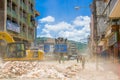 Portoviejo, Ecuador - April, 18, 2016: Heavy machinery picking rubble from destroyed buildings after tragic and