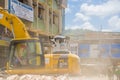 Portoviejo, Ecuador - April, 18, 2016: Heavy machinery picking rubble from destroyed buildings after tragic and