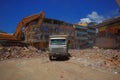 Portoviejo, Ecuador - April, 18, 2016: Heavy machinery picking rubble from destroyed buildings after tragic and