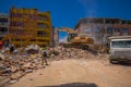 Portoviejo, Ecuador - April, 18, 2016: Heavy machinery picking rubble from destroyed buildings after tragic and