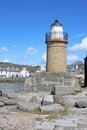Portpatrick lighthouse and village, Scotland Royalty Free Stock Photo