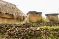 portrai of a traditional house in Wologai village built in the middle of a neatly arranged pile of stones. Taken in