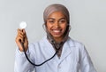 Portraif of black muslim female doctor in hijab with stethoscope