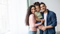 Portraif Of Happy Arabic Parents Posing With Their Little Daughter At Home Royalty Free Stock Photo