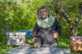 Portrain of Ukrainian smiling senior bee-keeper