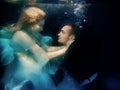 Portrair of young dancing couple underwater Royalty Free Stock Photo