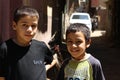 Portrait of 2 boys smiling, street background in giza, egypt