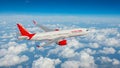 portrait from above of an Air India plane with a background of clouds Royalty Free Stock Photo