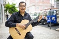 Aoustic guitar player on the street of Alfama in Lisbon, Portugal Royalty Free Stock Photo
