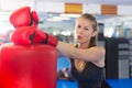 Portrait of active female with punching bag Royalty Free Stock Photo