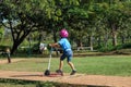 Cute little girl playing as a little archaeologist with her mother digging dinosaur fossils in the playground. Children learning Royalty Free Stock Photo