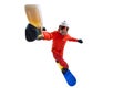 Portrait of active man, snowboarder in uniform riding on snowboard and holding beer glass isolated over white studio Royalty Free Stock Photo