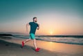 Portrait of active middle age man jogging running outside by sea. Royalty Free Stock Photo