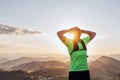 Portrait of Active mountain trail runner dressed bright t-shirt with backpack and sport sunglasses resting while he sky running by