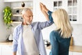 Portrait Of Active Senior Couple Dancing Together At Home Royalty Free Stock Photo