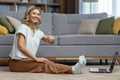 Portrait of active woman at home doing fitness and exercise and yoga, mature housewife looking at camera and smiling Royalty Free Stock Photo