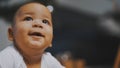 Portrait of adorable african american black baby with funny face expression Royalty Free Stock Photo