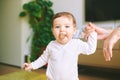 Portrait of adorable baby playing with cork