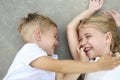 Portrait of adorable brother and sister smile and laugh together outdoors Royalty Free Stock Photo