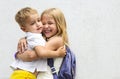 Portrait of adorable brother and sister smile and laugh together outdoors Royalty Free Stock Photo