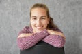 Friendly  teenage girl sitting on a chair Royalty Free Stock Photo