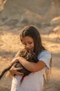 Portrait of adorable child with kitten. Baby girl holding hands a kitten in the light of sunset, pet, friend, lifestyle Royalty Free Stock Photo