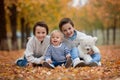 Portrait of adorable children, brothers, in autumn park,playing