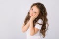 Portrait of adorable dreaming little girl isolated on a white