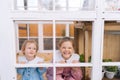 Portrait of adorable funny little children girls sisters in beautiful dress standing posing in summer gazebo house on Royalty Free Stock Photo