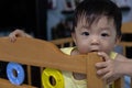 Adorable and happy Chinese 1 year old baby boy child playing on bed Royalty Free Stock Photo