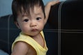 Adorable and happy Chinese 1 year old baby boy child playing on bed Royalty Free Stock Photo