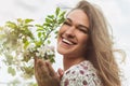 Portrait of adorable happy girl near the blooming apple tree Royalty Free Stock Photo