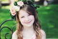 Portrait of adorable kid girl with floral wreath