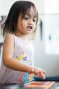 Portrait of adorable little asian girl being creative and working on a painting for artwork. Confidence Positivity Freedom Be Royalty Free Stock Photo