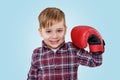 Portrait of an adorable little boy wearing boxing gloves Royalty Free Stock Photo