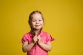Portrait of adorable little cute female child holding hair posing looking at camera medium shot Royalty Free Stock Photo