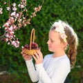 Portrait adorable little girl with basket of the fruits outdoor. Summer or Autumn. Harvest. Shavuot. Royalty Free Stock Photo