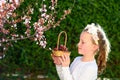 Portrait adorable little girl with basket of the fruits outdoor. Summer or Autumn. Harvest. Shavuot. Royalty Free Stock Photo