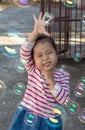 Portrait of adorable little girl child enjoying playing with soap bubbles Royalty Free Stock Photo