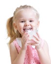 Portrait of adorable little girl drinking glass of Royalty Free Stock Photo