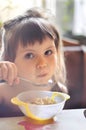 Portrait of adorable little girl having lunch
