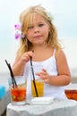 Portrait of adorable little girl with juice