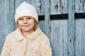 Portrait of adorable little girl outdoors on cold winter day. Cute preschool child in warm clothes, with knitted hat and Royalty Free Stock Photo