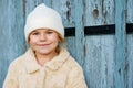Portrait of adorable little girl outdoors on cold winter day. Cute preschool child in warm clothes, with knitted hat and Royalty Free Stock Photo
