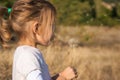 Little girl playing in an autumn field Royalty Free Stock Photo