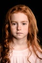 Portrait of adorable redhead girl looking at camera Royalty Free Stock Photo